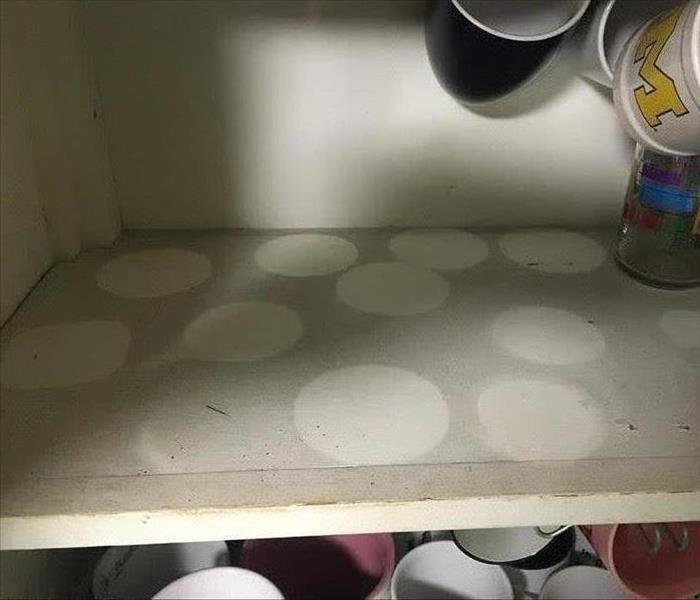 Cupboard filled with soot