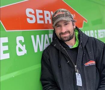 Dave standing in front of SERVPRO vehicle