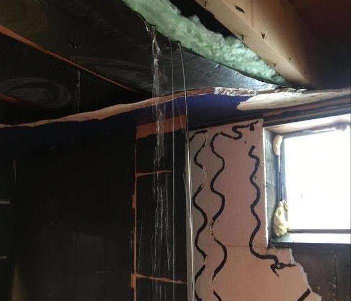 Water pouring from basement ceiling.