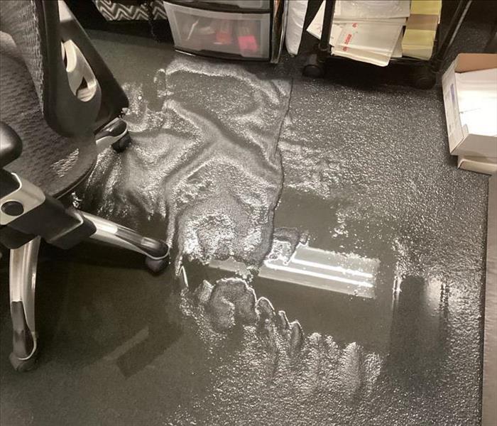 Puddle of water on office carpet